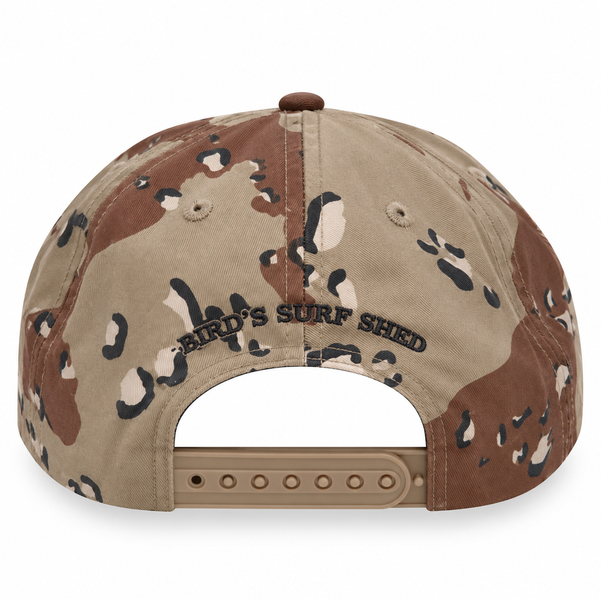 Back view of a desert camouflage snapback cap with 'BIRD'S SURF SHED' embroidered on the center panel, set against a plain white background.